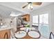 Sunlit breakfast nook with charming wooden furniture and a ceiling fan at 9335 Stonewall, New Port Richey, FL 34655