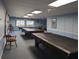 Spacious game room featuring multiple billiards tables under bright, recessed lighting at 9335 Stonewall, New Port Richey, FL 34655