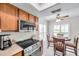 Cozy breakfast nook, stainless steel appliances and light-filled kitchen with plenty of natural light at 9335 Stonewall, New Port Richey, FL 34655