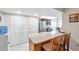 Bright kitchen featuring a breakfast bar with seating and stainless steel appliances at 9335 Stonewall, New Port Richey, FL 34655