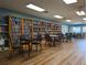 A cozy community library with floor-to-ceiling bookshelves and comfortable reading areas at 9335 Stonewall, New Port Richey, FL 34655