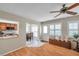 Open-concept living area with hardwood floors leading to a sunny breakfast nook at 9335 Stonewall, New Port Richey, FL 34655