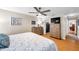 Bedroom featuring a ceiling fan, two dressers, hardwood floors, and neutral paint at 9335 Stonewall, New Port Richey, FL 34655