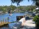 Scenic waterfront featuring a boat ramp, docks, and a tranquil waterway at 9335 Stonewall, New Port Richey, FL 34655