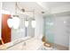 Bathroom with frameless shower and ornate lighting at 934 Jerry Smith Rd, Dover, FL 33527