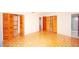 Spacious bedroom with parquet floors and large closet at 934 Jerry Smith Rd, Dover, FL 33527