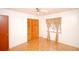 Bright bedroom featuring parquet floors and a large closet at 934 Jerry Smith Rd, Dover, FL 33527