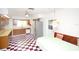 Bright eat-in kitchen with checkered floors, stainless steel refrigerator, and a cozy dining nook at 934 Jerry Smith Rd, Dover, FL 33527