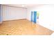 Spacious living room with parquet floors and a sliding glass door to the outdoors at 934 Jerry Smith Rd, Dover, FL 33527