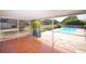 Screened patio that provides an amazing view of the inground pool at 934 Jerry Smith Rd, Dover, FL 33527