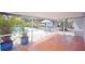 Enclosed patio overlooking the backyard with a pool; great for outdoor enjoyment and entertaining at 934 Jerry Smith Rd, Dover, FL 33527