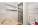 Cozy bathroom featuring a tiled shower, toilet, and pedestal sink at 936 Alcazar Way S, St Petersburg, FL 33705