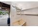 Bathroom featuring a vanity, shelving, and view into the garage at 936 Alcazar Way S, St Petersburg, FL 33705