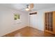 Cozy bedroom with wood floors, a large window, and a classic door at 936 Alcazar Way S, St Petersburg, FL 33705