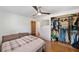 Well-appointed bedroom featuring wood floors, closet, and comfortable bed at 936 Alcazar Way S, St Petersburg, FL 33705