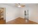 Inviting bedroom showcasing wood floors, neutral walls, and ample doorway access at 936 Alcazar Way S, St Petersburg, FL 33705