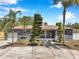 Charming single-story home with well-manicured landscaping and a welcoming front porch at 936 Alcazar Way S, St Petersburg, FL 33705