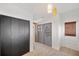 Hallway featuring stylish doors, tile flooring, and access to multiple rooms at 936 Alcazar Way S, St Petersburg, FL 33705