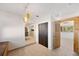 Hallway leading to the kitchen and other rooms, featuring tiled floors and bright lighting at 936 Alcazar Way S, St Petersburg, FL 33705