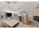 Kitchen with stainless steel appliances and a breakfast bar, offering modern functionality and style at 936 Alcazar Way S, St Petersburg, FL 33705