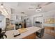 Bright kitchen featuring stainless steel appliances, open shelving, and a breakfast bar with seating at 936 Alcazar Way S, St Petersburg, FL 33705