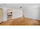 Open living room with hardwood floors and a view of the kitchen at 936 Alcazar Way S, St Petersburg, FL 33705