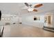 Bright living room with ceiling fans; the steps leads to another room at 936 Alcazar Way S, St Petersburg, FL 33705