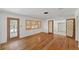 Inviting living room with hardwood floors, large windows, and wood shutters at 936 Alcazar Way S, St Petersburg, FL 33705