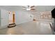 Spacious living room featuring sleek flooring, ceiling fans, and abundant natural light at 936 Alcazar Way S, St Petersburg, FL 33705