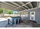 Covered patio boasts a built-in bar, providing an ideal setting for outdoor gatherings and entertainment at 936 Alcazar Way S, St Petersburg, FL 33705