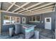This covered outdoor patio offers a built-in bar perfect for entertaining guests with easy access to the home's interior at 936 Alcazar Way S, St Petersburg, FL 33705