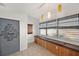 Comfortable seating area with natural light, access to a door, and stylish decor at 936 Alcazar Way S, St Petersburg, FL 33705