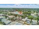 Lovely aerial view of a quiet neighborhood next to a lake, surrounded by lush greenery at 10505 Boyette Creek Blvd, Riverview, FL 33569