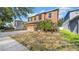 Two-story home with a driveway and some grass covered in a layer of fallen leaves at 10505 Boyette Creek Blvd, Riverview, FL 33569