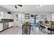 Bright kitchen featuring stainless steel appliances, breakfast bar, and sliding doors to outdoor pool at 10505 Boyette Creek Blvd, Riverview, FL 33569