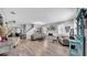 Open-concept living room featuring light-colored wood floors and neutral paint colors at 10505 Boyette Creek Blvd, Riverview, FL 33569