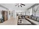 Spacious living room seamlessly connects to dining area and kitchen, featuring a comfortable leather sectional at 10505 Boyette Creek Blvd, Riverview, FL 33569