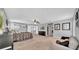Spacious bedroom with neutral carpet, a bed, and a seating area and closet at 10505 Boyette Creek Blvd, Riverview, FL 33569
