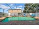 Fenced in pool area with brick deck, in-ground pool, and outdoor seating at 10505 Boyette Creek Blvd, Riverview, FL 33569