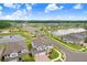 Aerial view featuring homes near tranquil lakes and a gated entrance, showcasing a well-planned community with green spaces at 10901 Sundrift Dr, Tampa, FL 33647