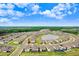 Aerial view showing home in a community with ponds and green spaces at 10901 Sundrift Dr, Tampa, FL 33647