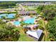A luxurious community pool with palm trees, lounge chairs and cabanas is the focal point of the community at 10901 Sundrift Dr, Tampa, FL 33647