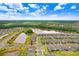 Aerial view showcasing a neighborhood with tranquil ponds, lush landscaping, and well-maintained homes in a scenic setting at 10901 Sundrift Dr, Tampa, FL 33647