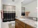 Bathroom featuring a shower, sink, vanity, and mirror at 10901 Sundrift Dr, Tampa, FL 33647