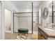 Modern bathroom showcasing a spacious walk-in shower with a tiled surround and glass enclosure at 10901 Sundrift Dr, Tampa, FL 33647
