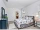 Modern bedroom with an accent wall, lots of natural light and en suite bathroom at 10901 Sundrift Dr, Tampa, FL 33647