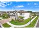 Beautiful home with a three-car garage, lush landscaping, and a well-maintained lawn in a friendly community at 10901 Sundrift Dr, Tampa, FL 33647