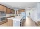 Bright kitchen boasts an island with counter seating and stainless steel appliances at 10901 Sundrift Dr, Tampa, FL 33647