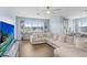 Inviting living room boasts natural light, neutral tones, and cozy furniture for relaxation at 10901 Sundrift Dr, Tampa, FL 33647