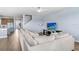 Spacious living room featuring contemporary decor, a large sofa, and wood-look flooring at 10901 Sundrift Dr, Tampa, FL 33647